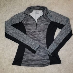 Jogging Sweater with zip up neck and thumb holes.